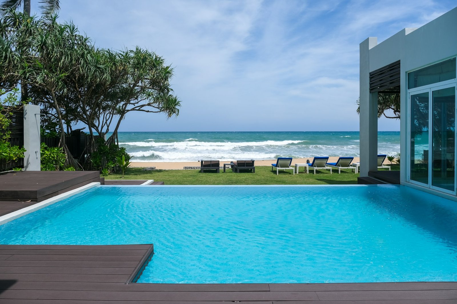 modern-house-with-a-swimming-pool-modern-pool-villa-at-the-beach.jpg